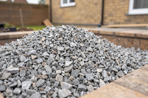 Freshly laid MOT Type 1 stone in a garden excavation.